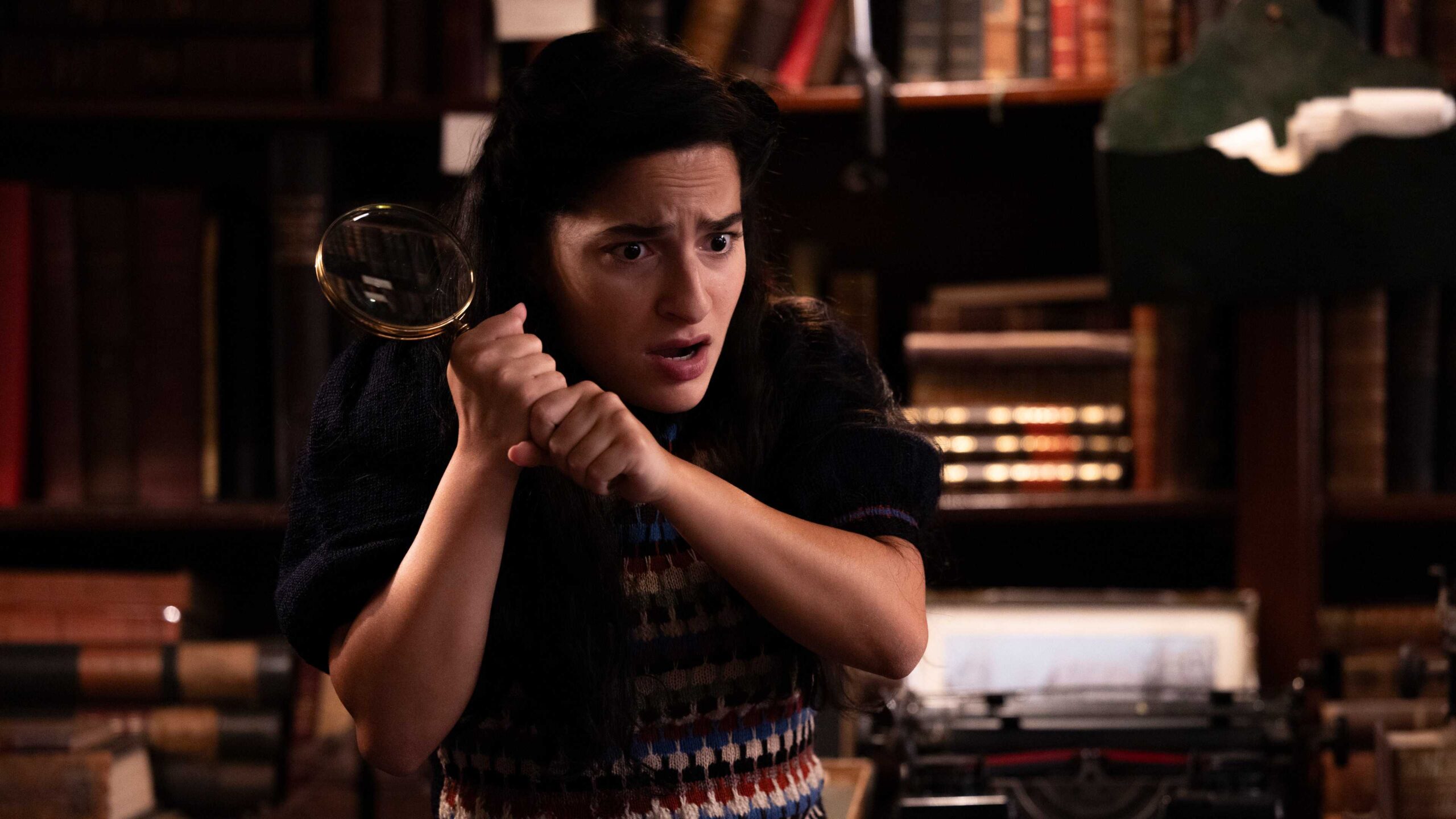 buket k m r as nora in bookish season 2 holding up a magnifying glass scaled 1