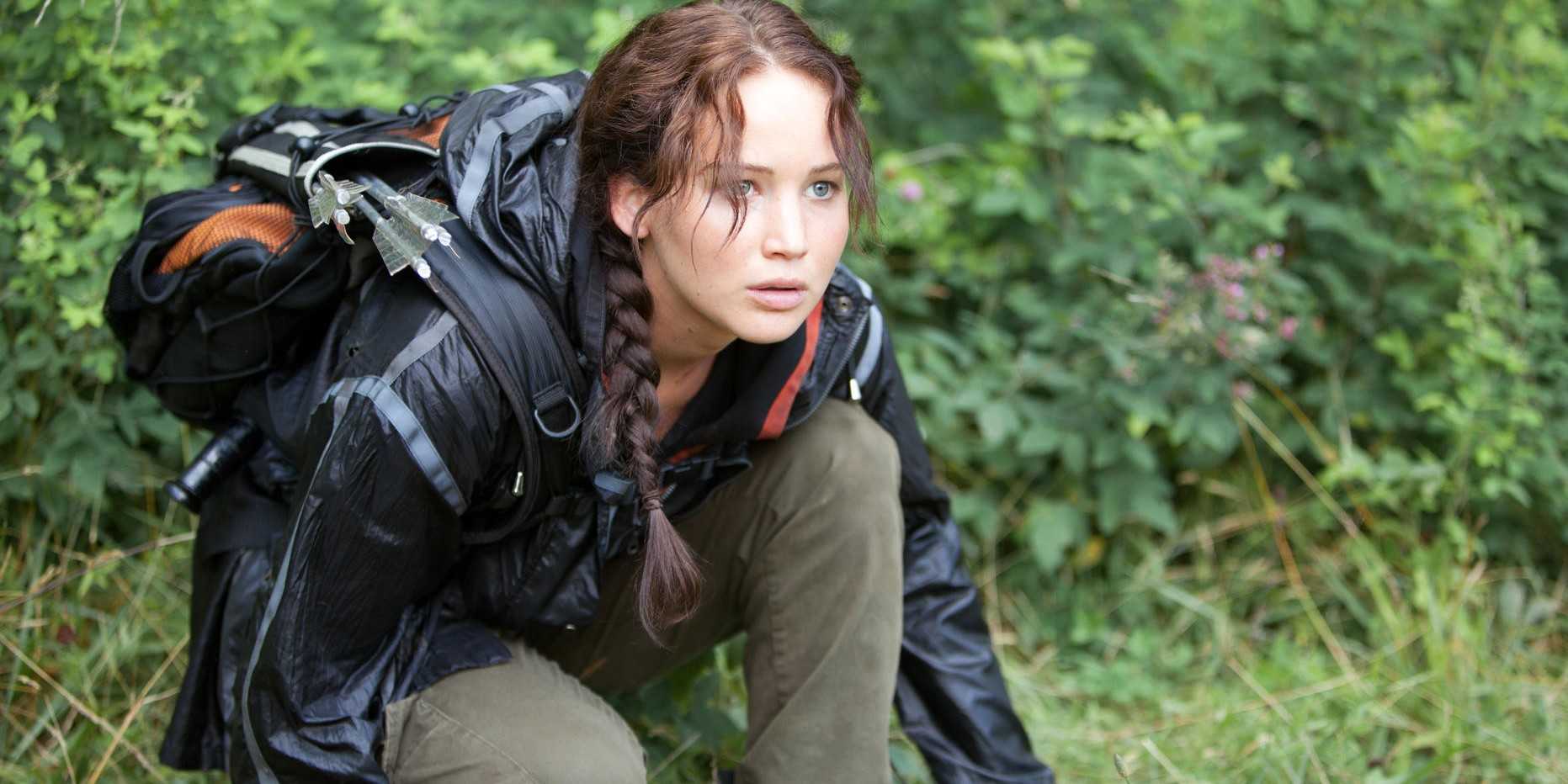 katniss kneeling and looking shocked in the hunger games