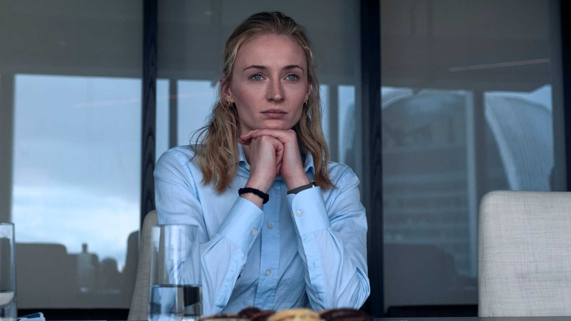 sophie turner with her hands folded looking serious in steal fz