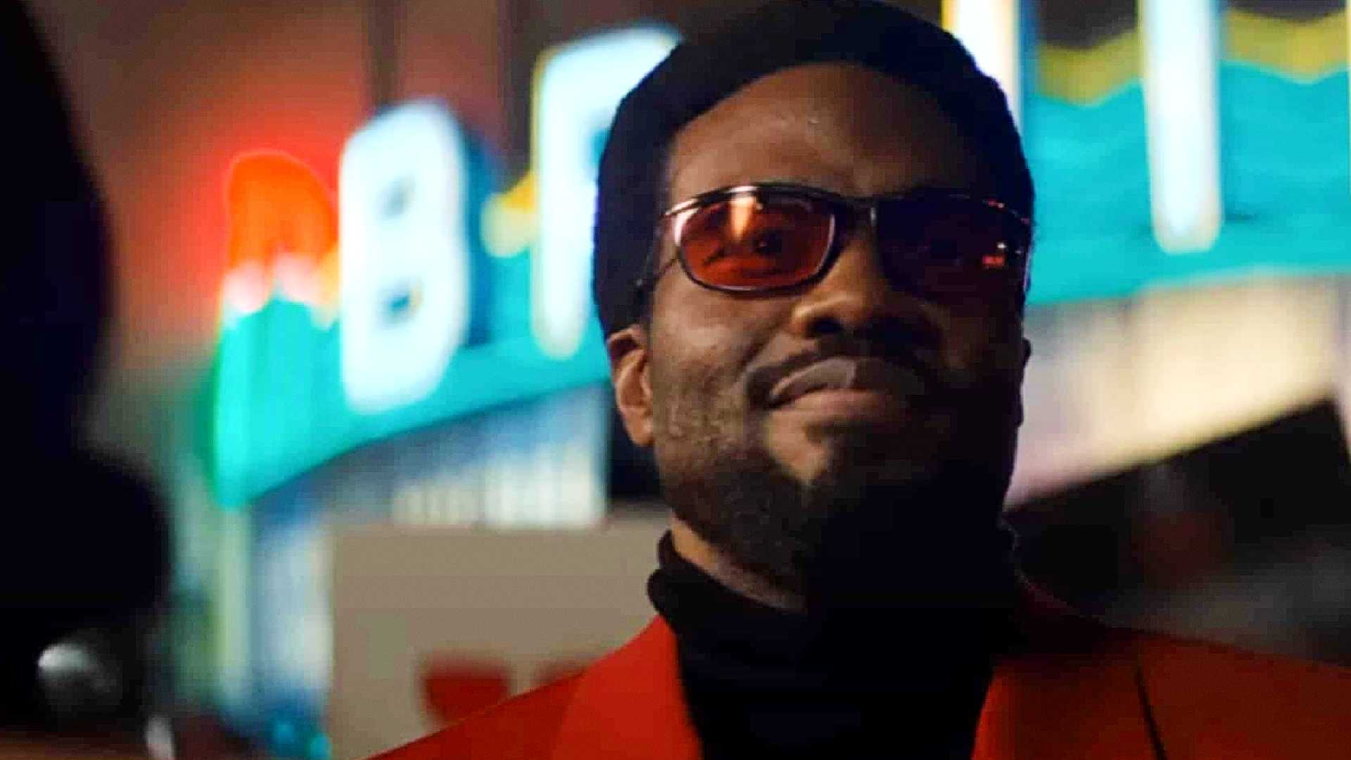 yahya abdul mateen iii s simon williams smiles wearing his red jacket and glasses in wonder man